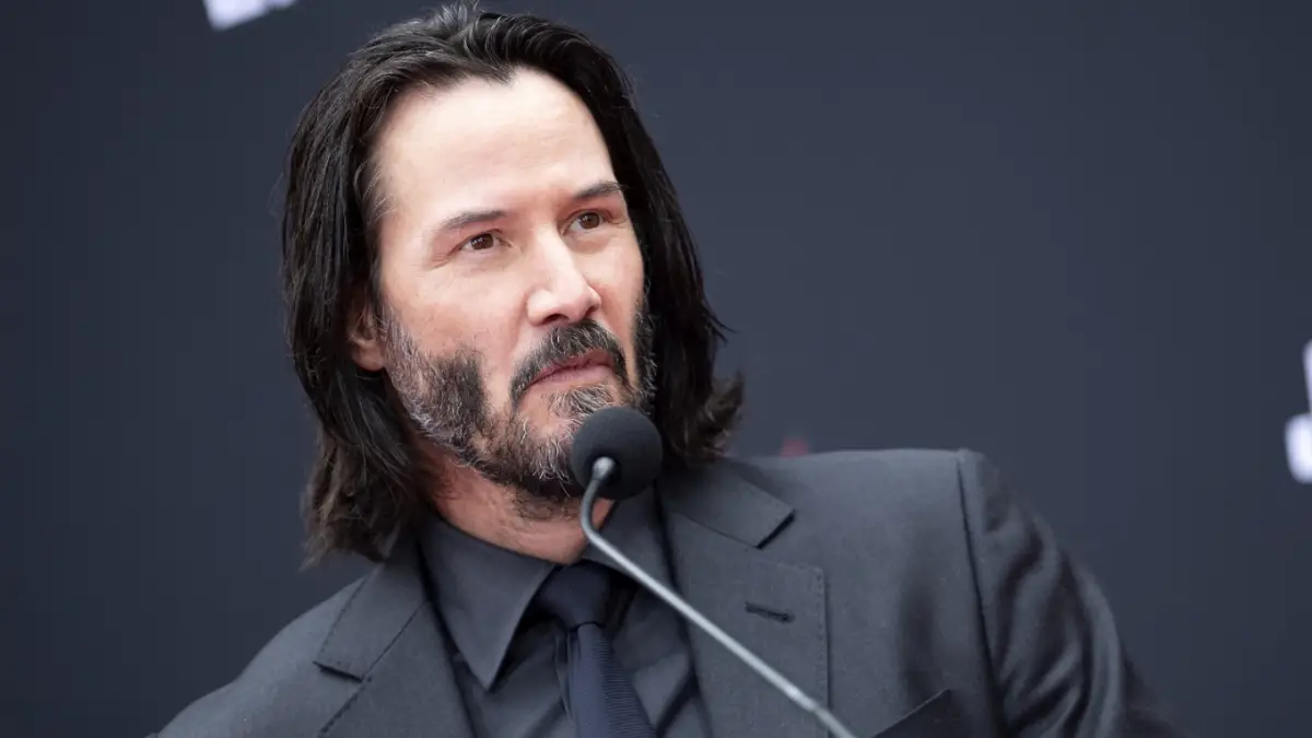 Keanu Reeves guiding a child through mindfulness, representing the serene and empathetic world of gentle parenting